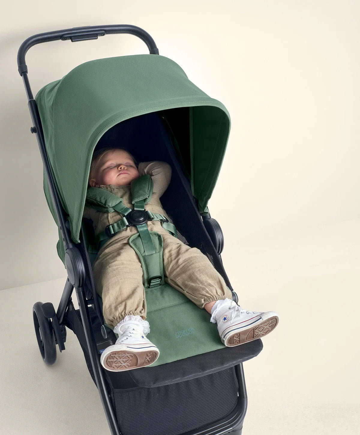 Green Mamas and Papas Libro Stroller with lay-flat seat recline and sleeping baby