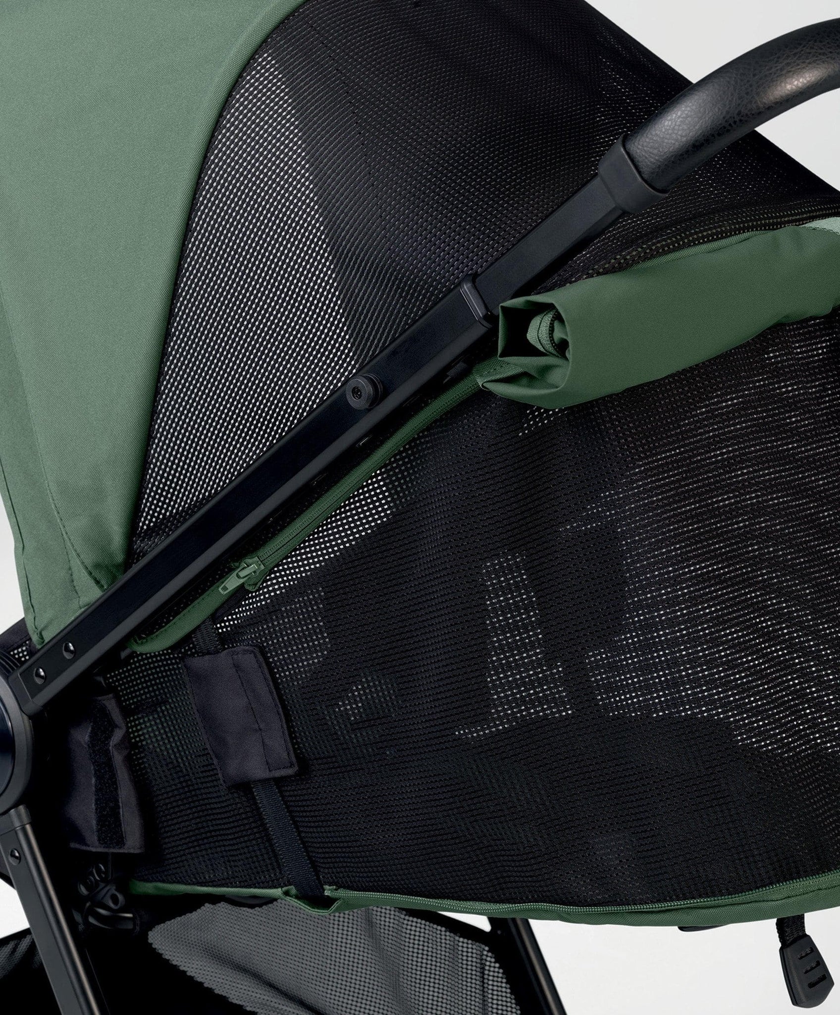 Green and black Mamas and Papas Libro Stroller with lay-flat seat recline feature