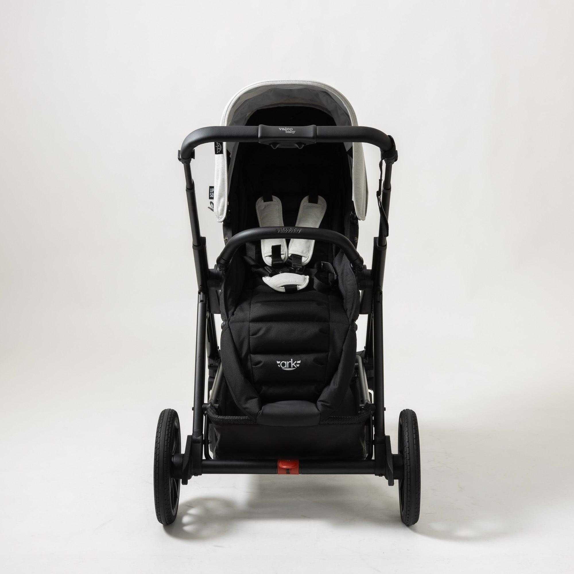 Black stroller with white straps in ValcoBaby ARK Joey Seat Bundle baby strollers
