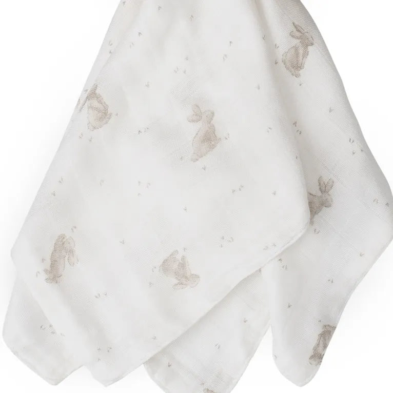 Two white towels with gray rabbit prints on a white background